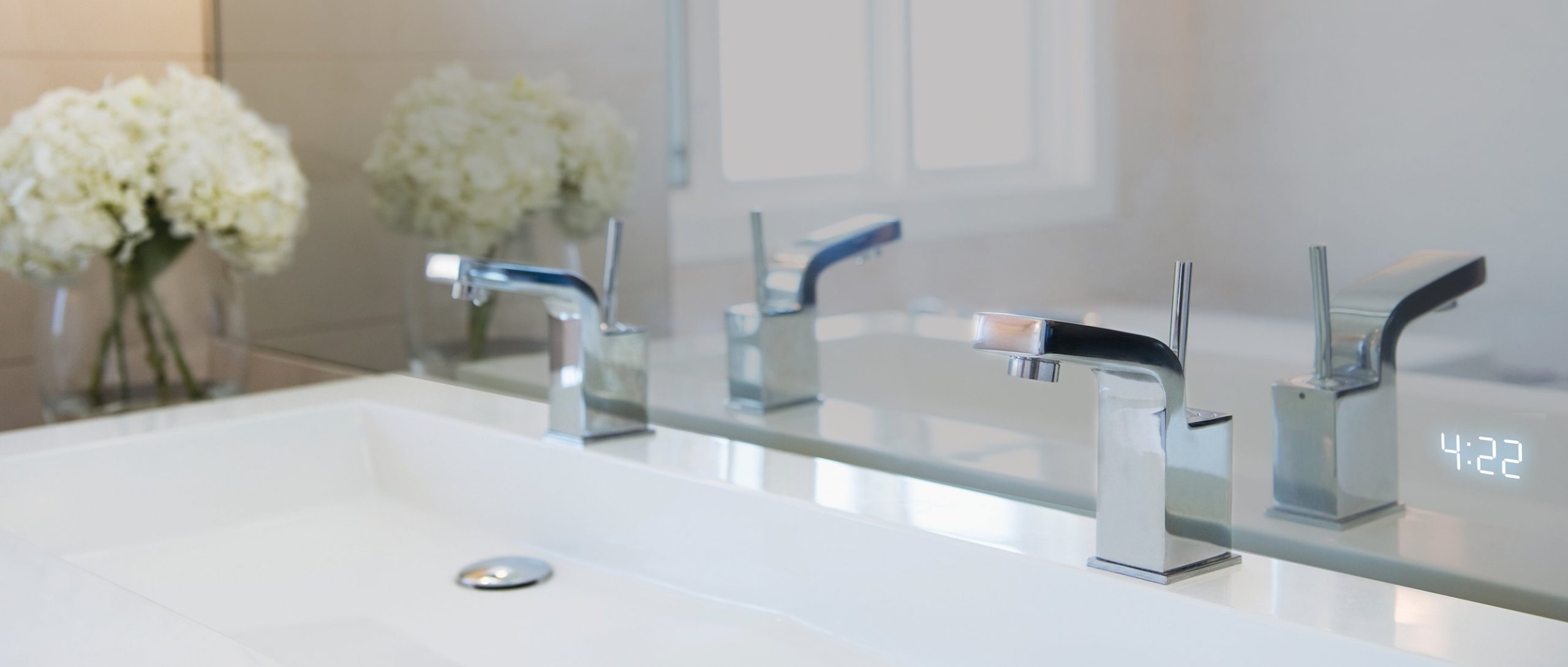 Seamless Clock in Lighted Mirror with flat sink